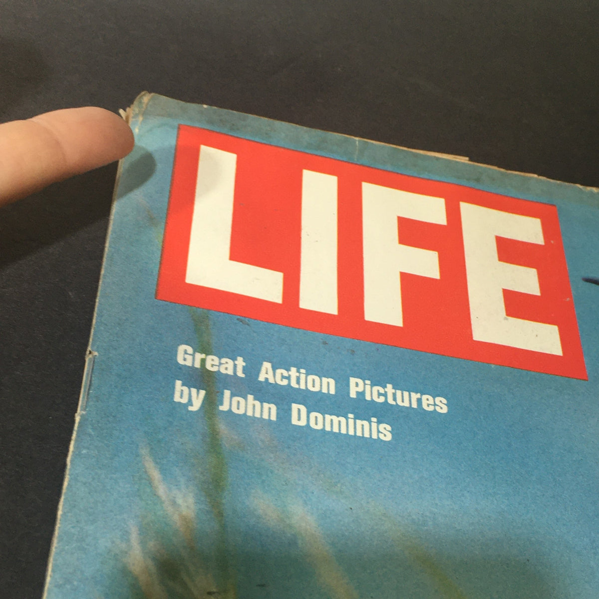 Close-up view of the cover of the VTG Life Magazine December 5, 1969, featuring the title 'LIFE' and a note about 'Great Action Pictures by John Dominis', showcasing the vintage aesthetic.