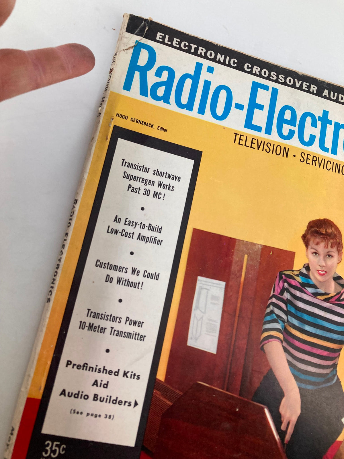 Close-up view of the cover of VTG Radio-Electronics Magazine May 1957, highlighting key topics such as transistor shortwave technology and DIY audio kits.