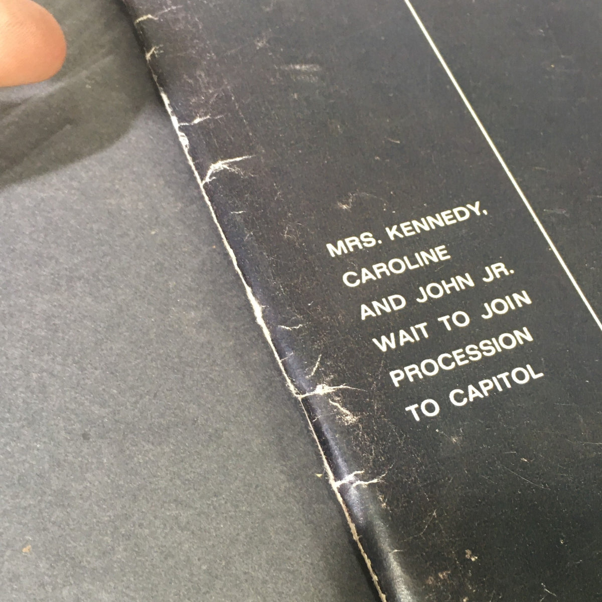 Detail of the VTG Life Magazine December 6, 1963, featuring a caption that reads 'Mrs. Kennedy, Caroline and John Jr. wait to join procession to Capitol'.