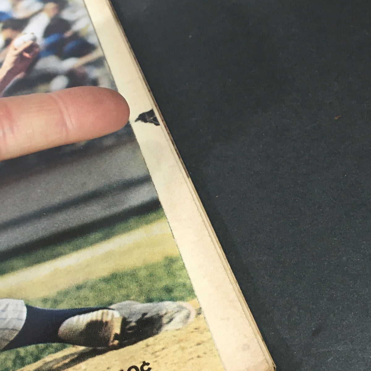 Side edge detail of Life Magazine September 26, 1969 cover, with a finger highlighting a small tear