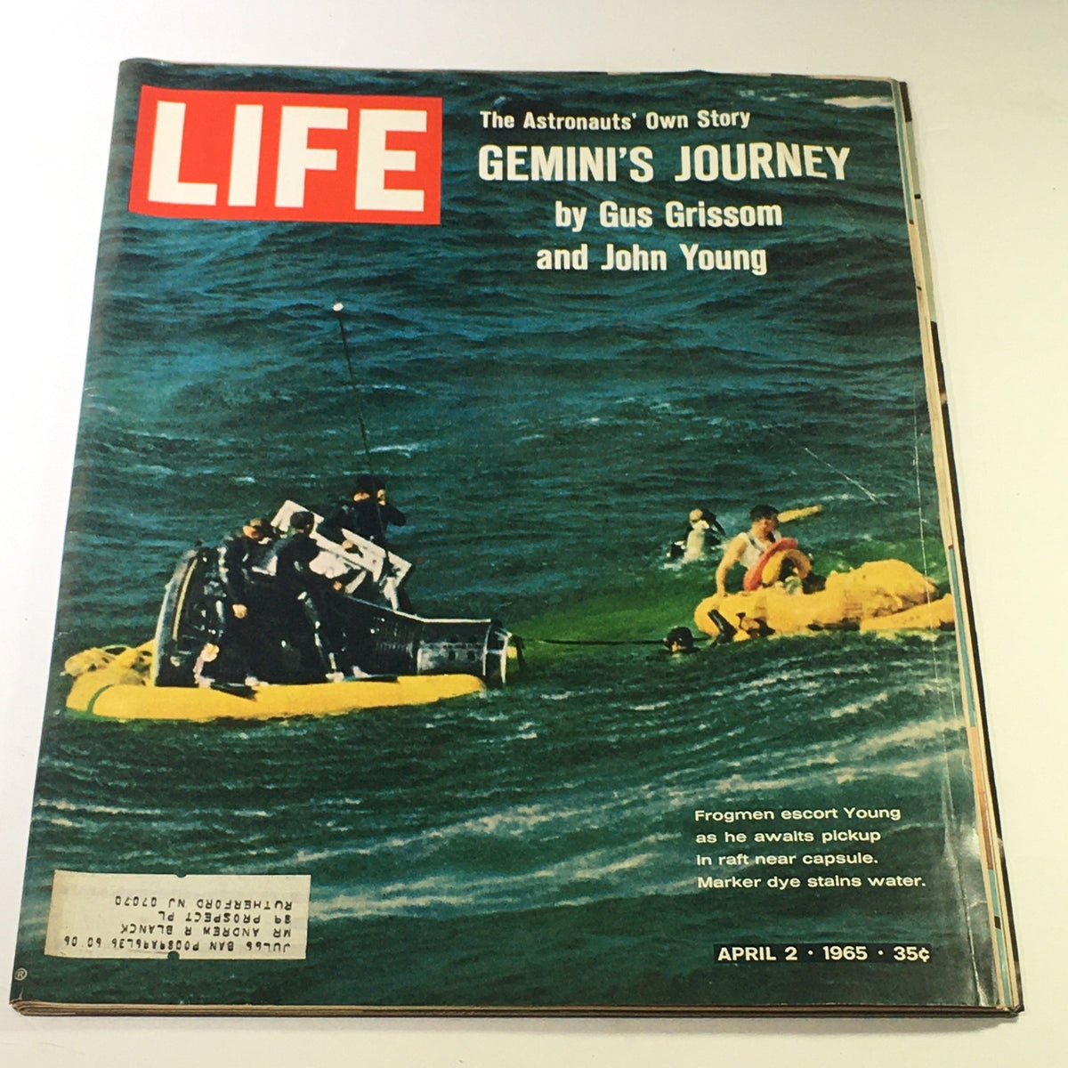 Vintage Life Magazine cover from April 2, 1965, featuring 'Gemini's Journey' by Gus Grissom and John Young, depicting frogmen assisting in the recovery of an astronaut near a capsule in the ocean.