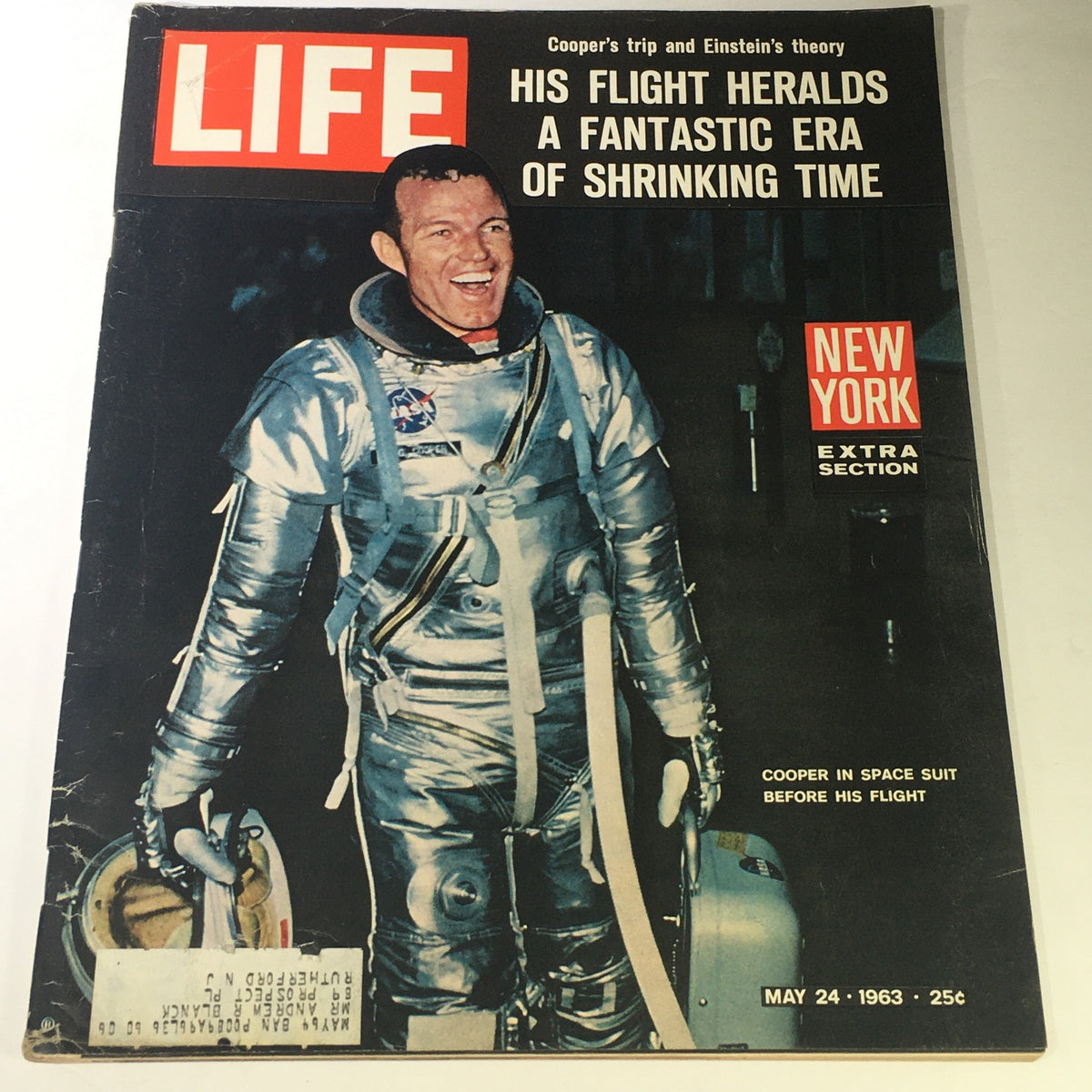 Cover of Life Magazine from May 24, 1963, featuring astronaut Gordon Cooper in a silver space suit, highlighting his historic trip and Albert Einstein's theory. The magazine captures the essence of the 1960s space exploration era.