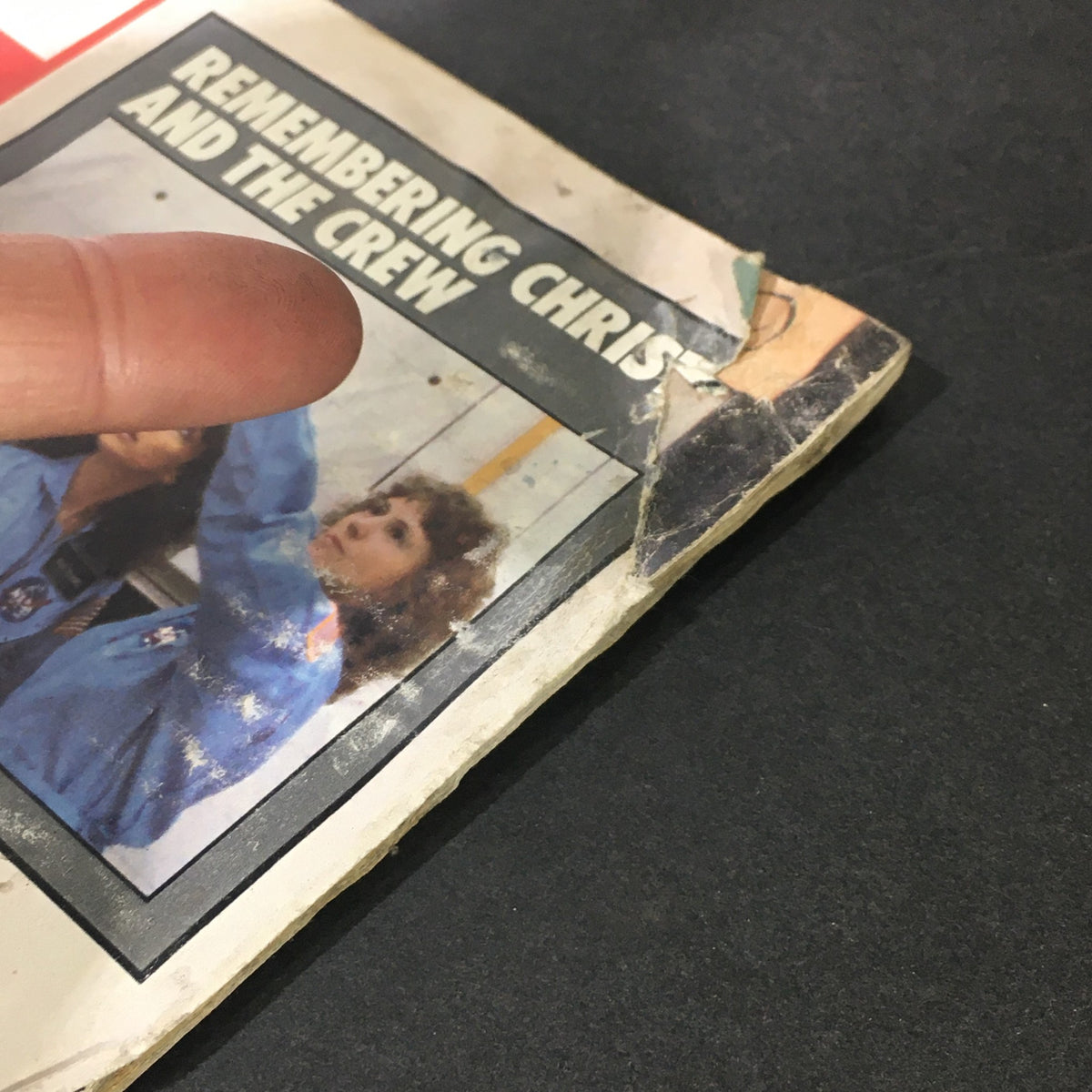 Close-up of the edge of the Vintage Life Magazine March 1986, highlighting wear and tear, including a torn area on the back cover.