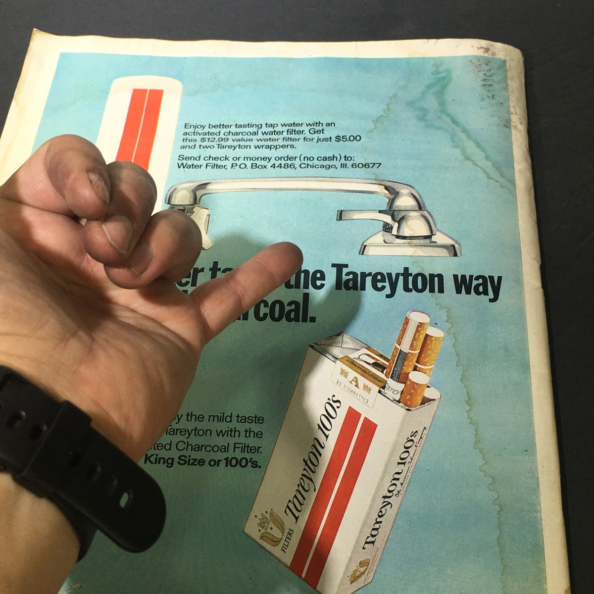 Vintage advertisement from Life Magazine May 14 1971 featuring Tareyton cigarettes and a charcoal water filter, with a hand gesture, highlighting retro marketing from the early 1970s.