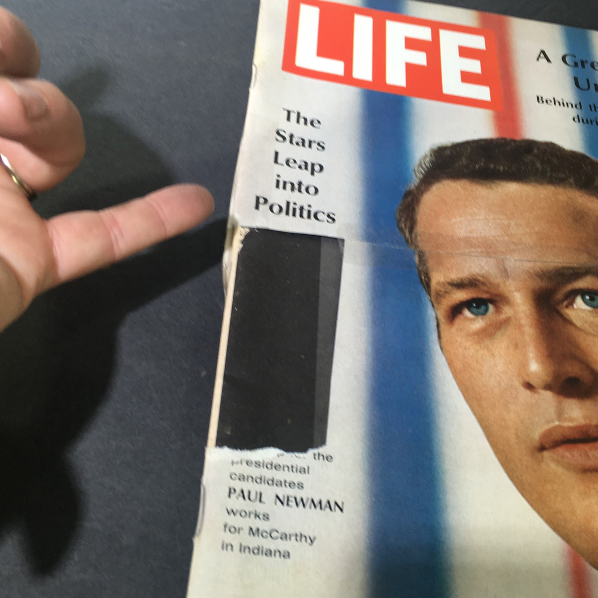 Close-up of the vintage Life Magazine cover dated May 10, 1968, highlighting Paul Newman's political engagement and the theme 'The Stars Leap into Politics'.