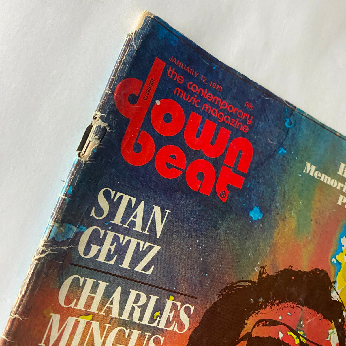 Cover of VTG Down Beat Magazine January 12 1978 featuring Stan Getz and Charles Mingus, showcasing vibrant colors and retro design.