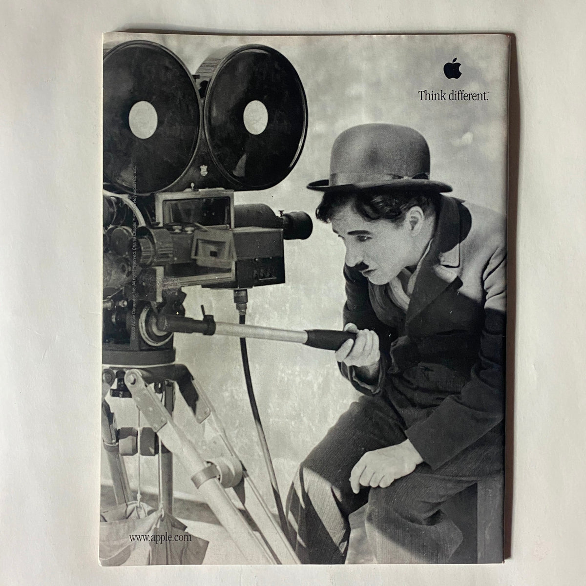 Back cover of Time Magazine from June 12, 2000, displaying a classic Apple advertisement featuring Charlie Chaplin, promoting the brand's 'Think different' campaign.
