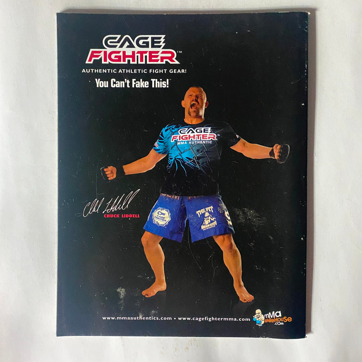 CAGE FIGHTER magazine cover showcasing an athletic fighter in action with the phrase 'You Can't Fake This!' highlighting the authenticity of MMA gear, related to Fight! Magazine March 2008 Dan Henderson Cover.