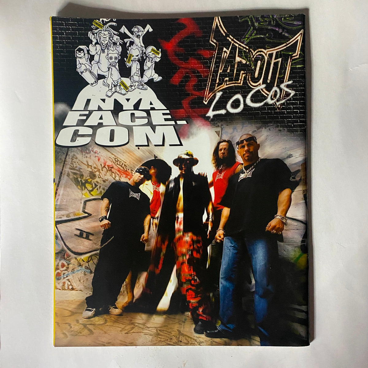 Tapout Magazine cover highlighting a group of individuals associated with MMA culture, representing the style and ethos of the sport.