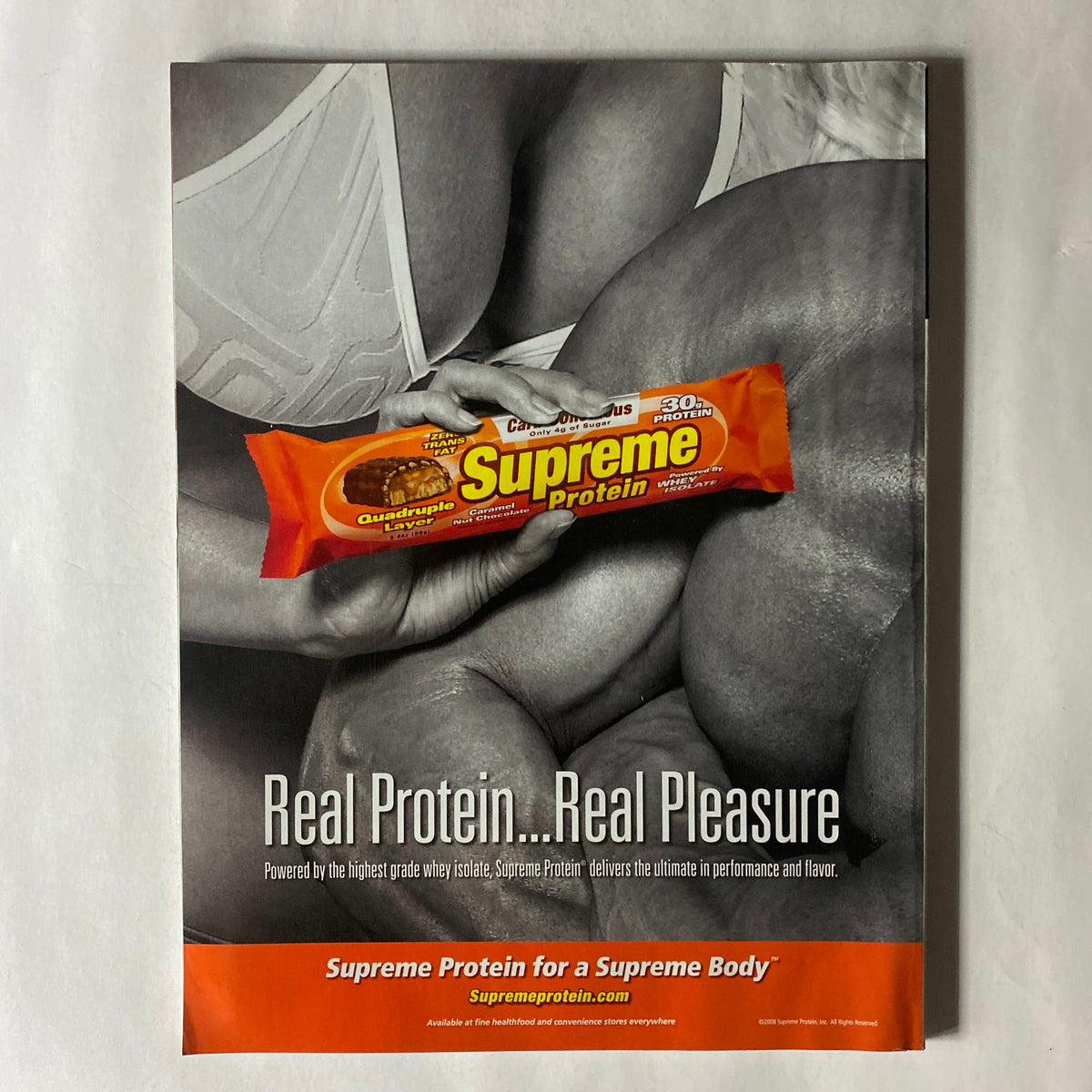 Advertisement for Supreme Protein featured in Fitness RX Magazine, showcasing a protein bar with the tagline 'Real Protein... Real Pleasure', emphasizing its performance benefits.