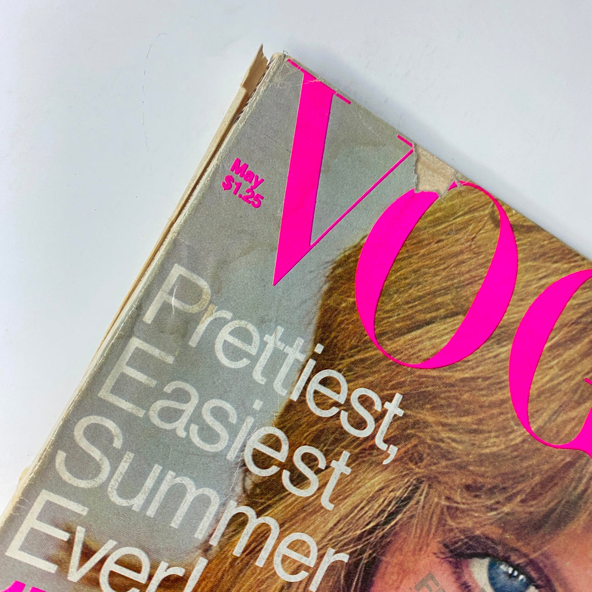 Close-up of the top corner of Vogue Magazine May 1976, highlighting the date and partial title emphasizing summer beauty.