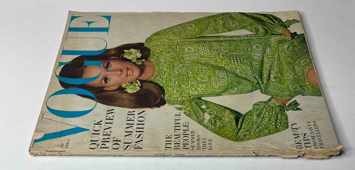 Vogue Magazine April 1, 1966 cover image displaying Brigitte Bauer in a green summer dress, emphasizing fashion trends and beauty tips.