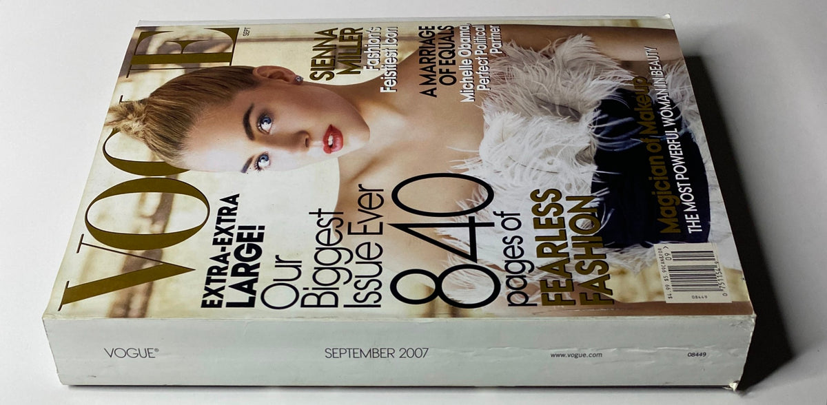 Side view of Vogue Magazine September 2007 with Sienna Miller on the cover, showcasing the magazine's size and highlighting its extensive content on fashion.