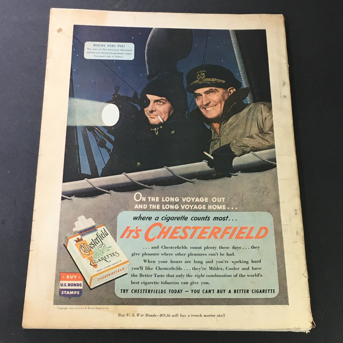 Back cover of the VTG Cosmopolitan Magazine April 1943 featuring an advertisement for Chesterfield cigarettes, set against a nighttime nautical scene.