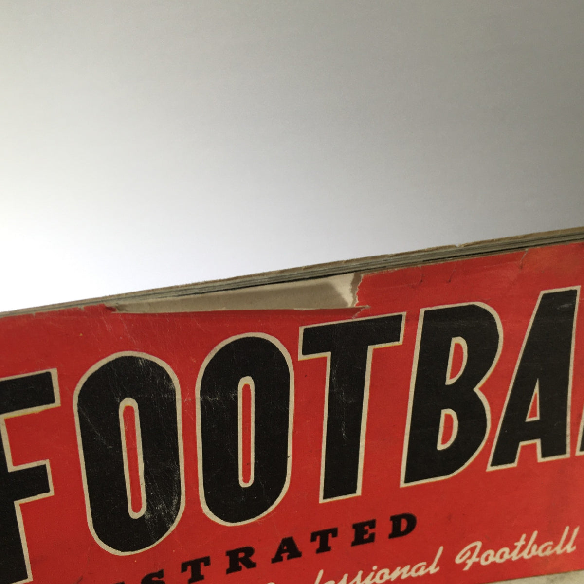 Close-up view of the vintage Pro Football Illustrated magazine from 1946, featuring the title in bold text, showcasing the Green Bay Packers.