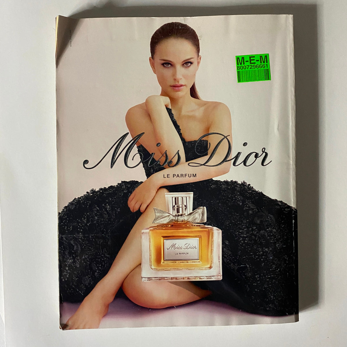 Advertisement for Miss Dior Le Parfum from British Vogue UK Magazine October 2013, featuring a glamorous model posed elegantly with the perfume.