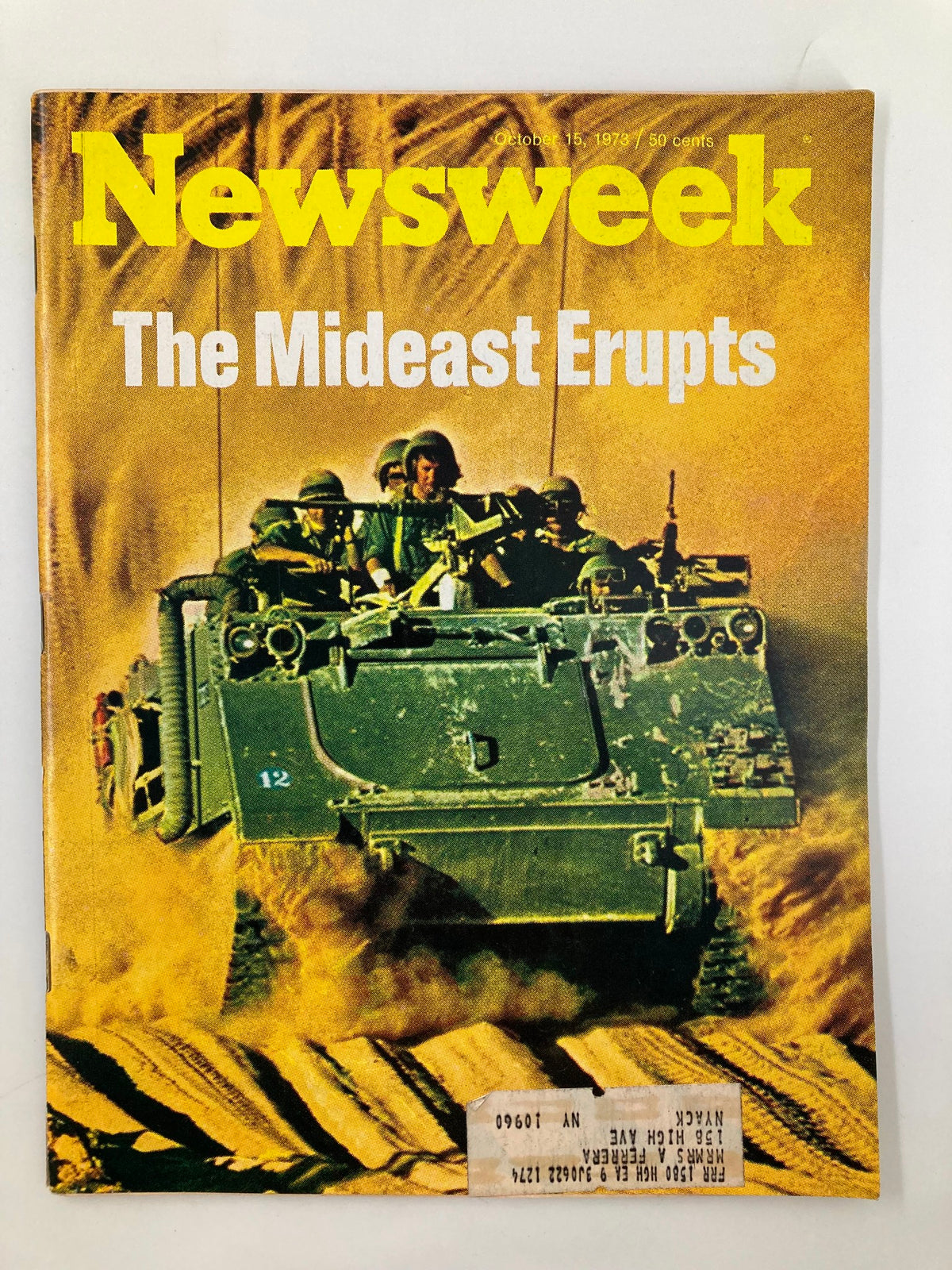 Vintage Newsweek Magazine cover from October 15, 1973, titled 'The Mideast Erupts,' featuring soldiers in an armored vehicle amidst desert terrain.