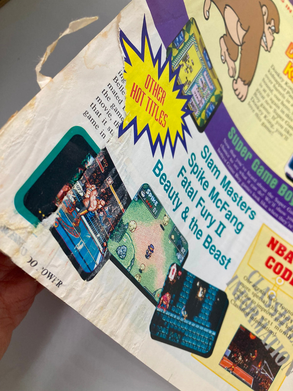 Back cover of Nintendo Power Magazine May 1994 Vol. 60 featuring 'Other Hot Titles' advertisement, showcasing various classic video games.