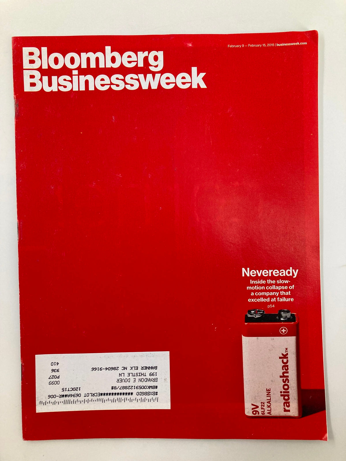 Cover of Bloomberg Businessweek Magazine February 9, 2015 featuring the title 'Neveready Slow-Motion Collapse' with a red background and RadioShack advertisement.