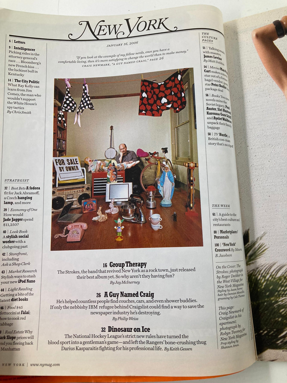 Page from New York Magazine dated January 16, 2006, featuring a cluttered room with various items and decorations, highlighting the issue's cover story 'Is This Finally It For The Strokes?'. This vintage magazine explores the significance of The Strokes in music history.