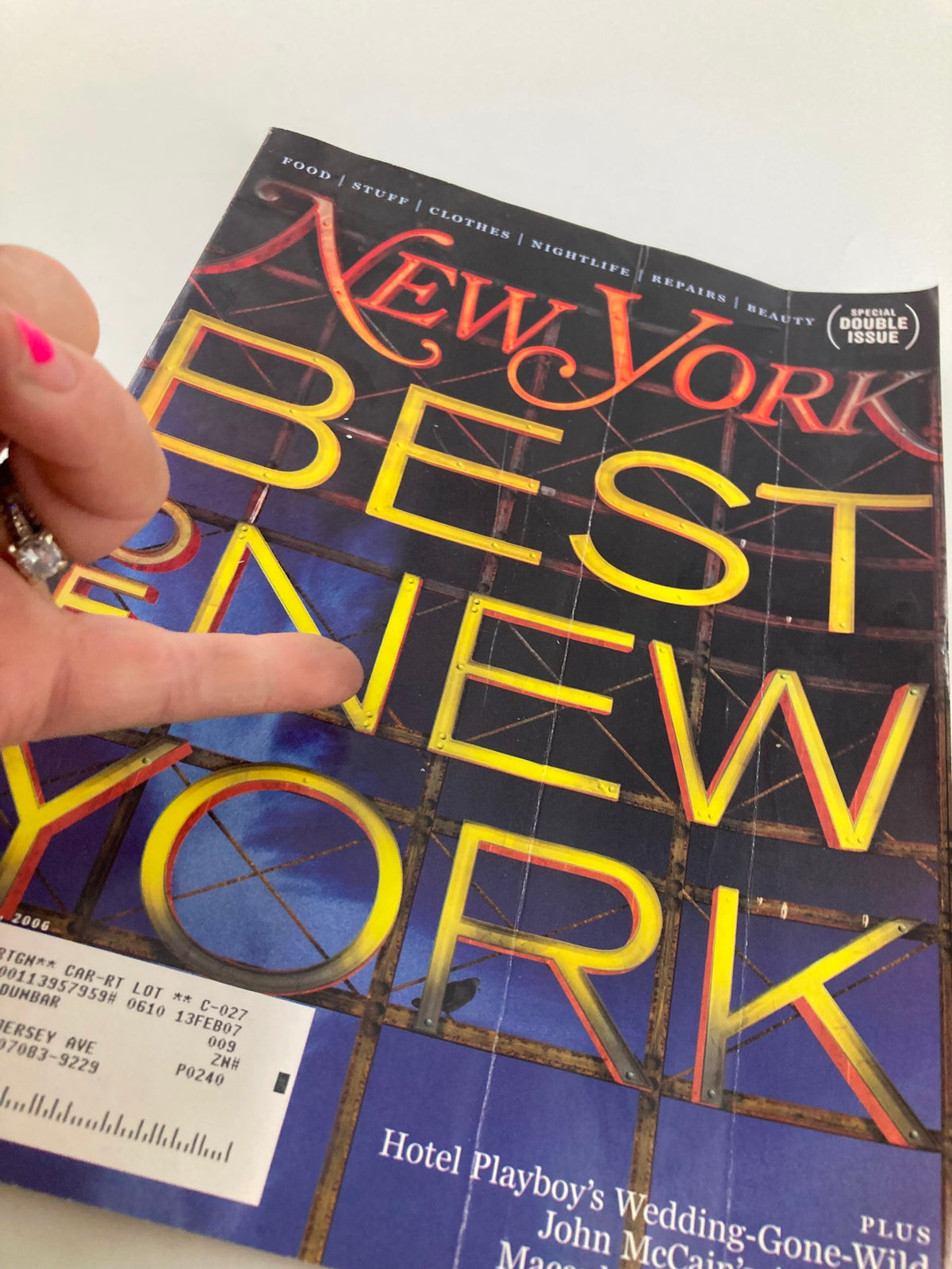 Cover of New York Magazine March 13, 2006 featuring 'Best of New York' with a focus on vibrant typography and a hand pointing at the title.