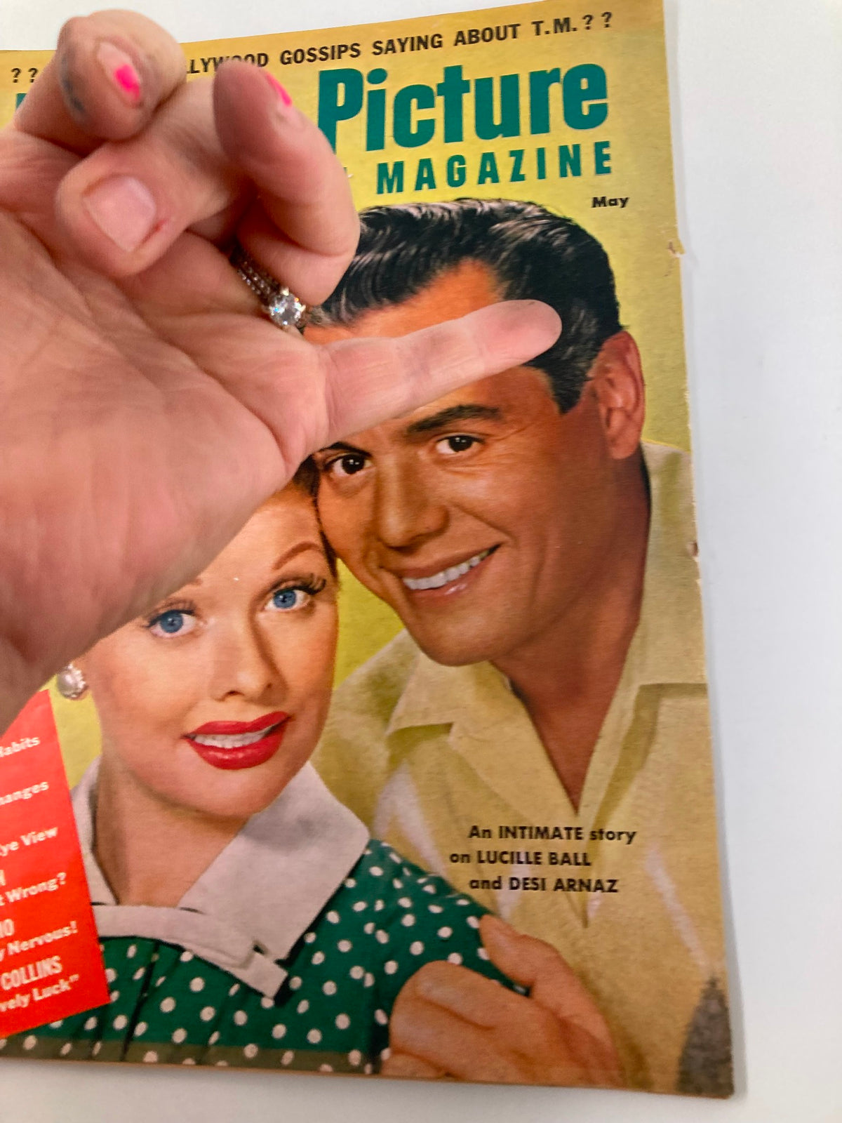 Cover of VTG Motion Picture and Television Magazine May 1954 featuring Lucille Ball and Desi Arnaz, showcasing their classic Hollywood charm.