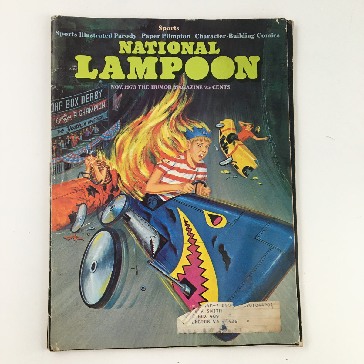 Cover of National Lampoon Humor Magazine from November 1973 featuring a colorful illustration parodying Sports Illustrated, showcasing a humorous depiction of a go-kart race.