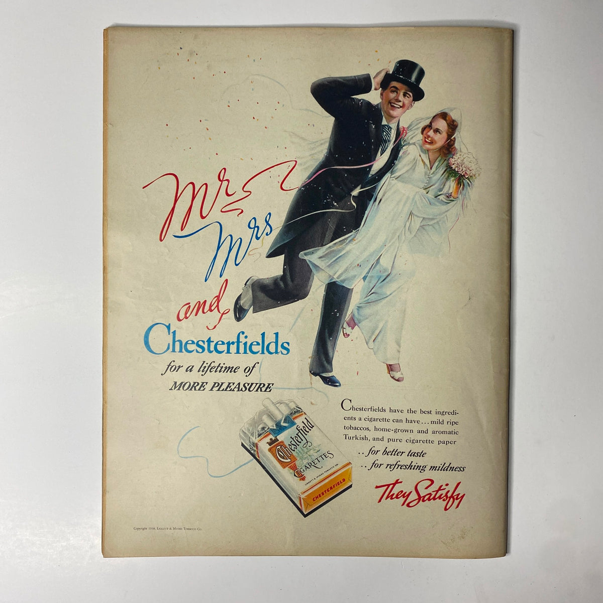 Advertisement page in Look Magazine from June 7, 1938, promoting Chesterfield cigarettes with a colorful illustration of a couple at their wedding, showcasing 1930s advertising style and themes.