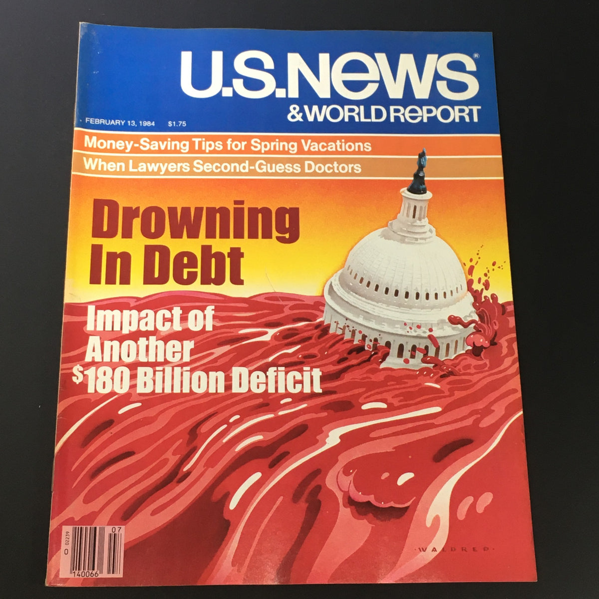 Cover of VTG US News & World Report Magazine from February 13, 1984, featuring the title 'Drowning in Debt' and a graphic representation of the U.S. Capitol amidst a swirling red background, symbolizing economic challenges and a $180 billion deficit.