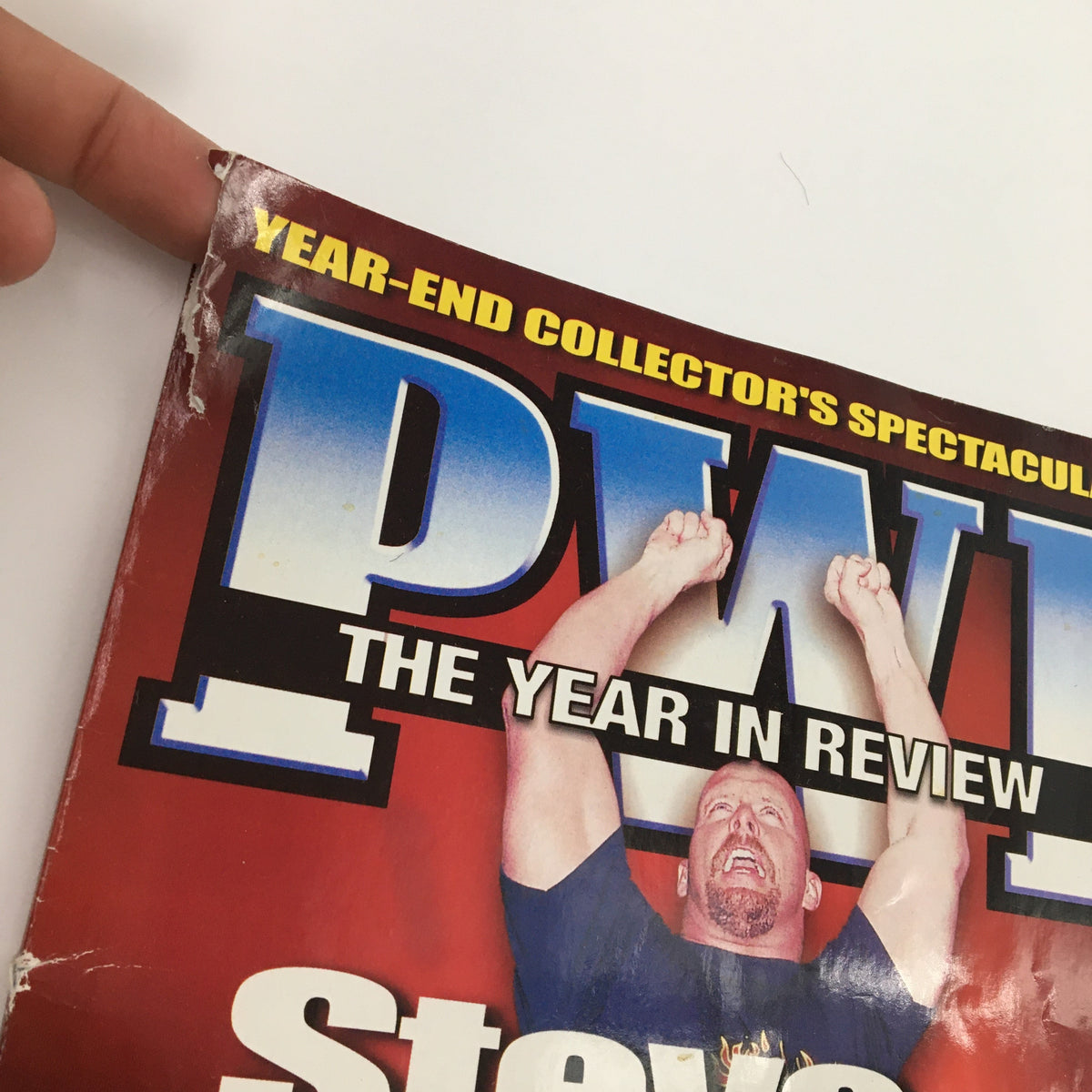 Close-up view of the Pro Wrestling Illustrated Magazine April 2002 cover featuring Steve Austin, highlighting the tear in the corner and the 'Year-End Collector's Spectacular' tagline.