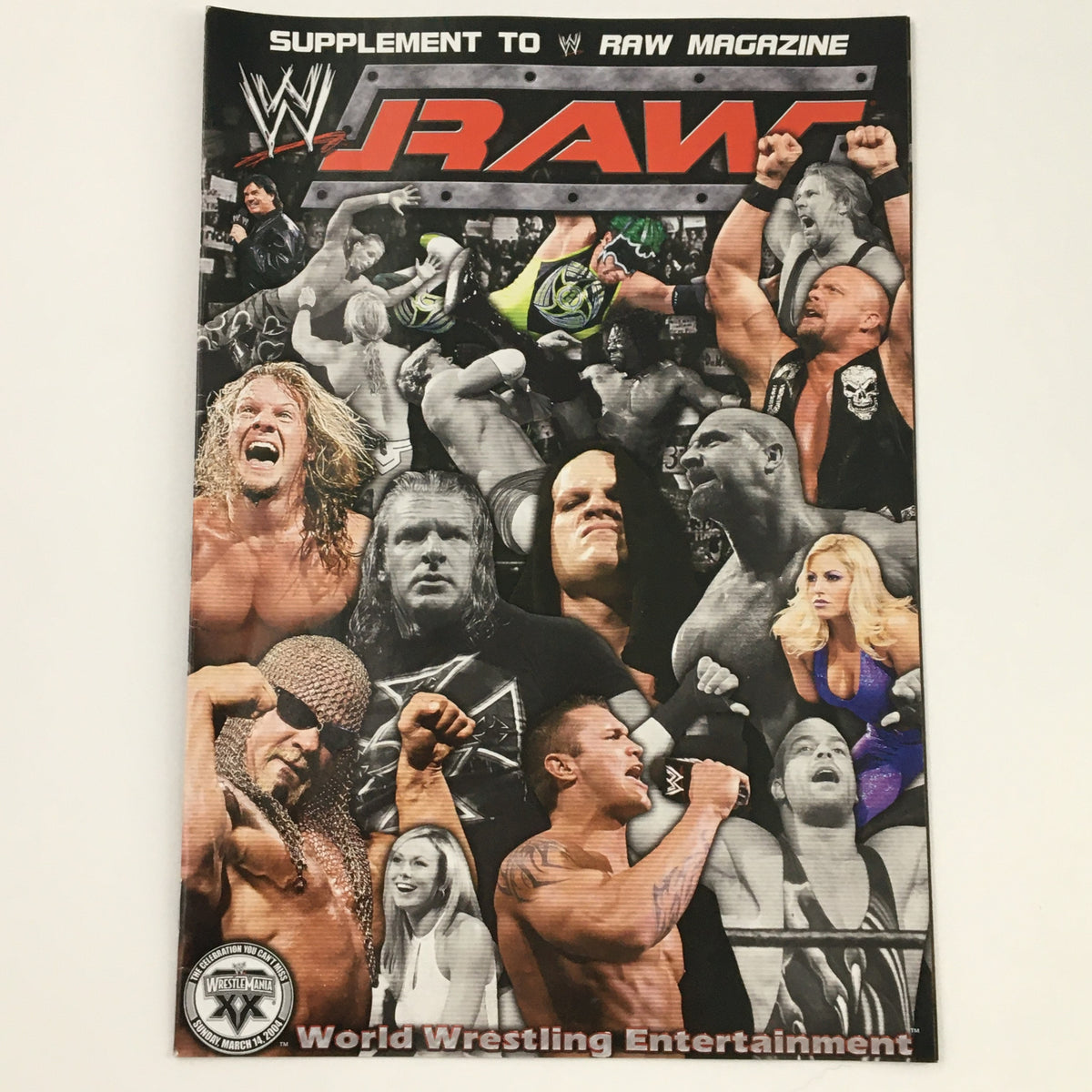 Cover of WWE Raw Magazine 2003 featuring multiple wrestling stars including Edge, Randy Orton, and Trish Stratus. This vintage magazine captures the excitement of WWE's Monday Night Raw, showcasing iconic figures from professional wrestling.