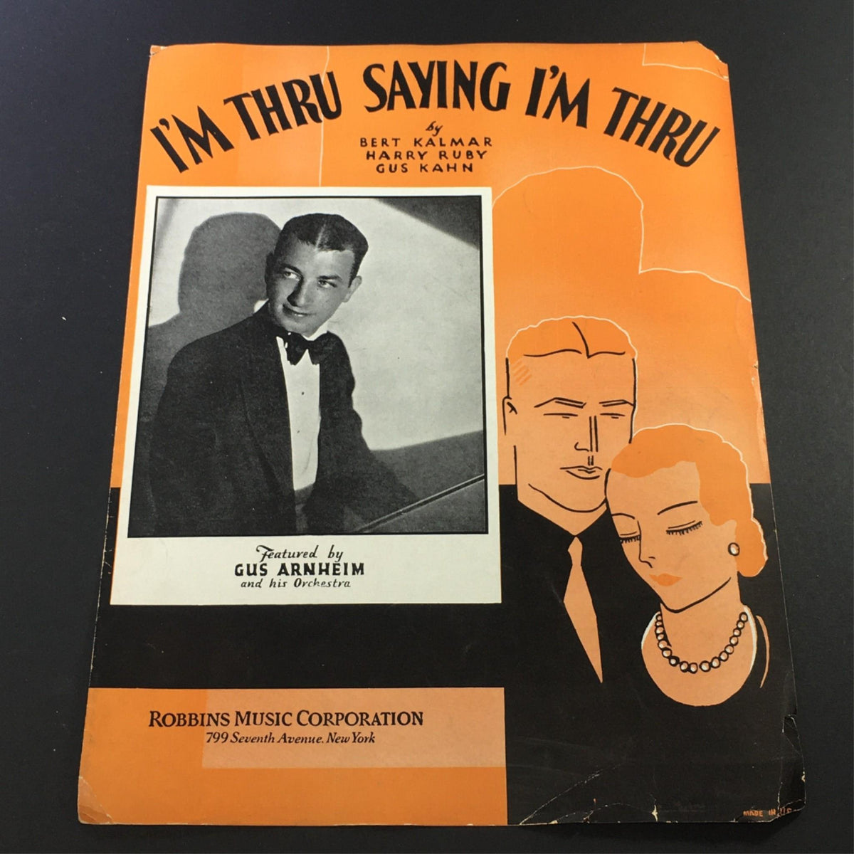 Vintage sheet music cover for "I'm Thru Saying I'm Thru" by Bert Kalmar, Harry Ruby, and Gus Kahn, featuring illustrations of a man in a tuxedo and a woman in elegant attire, published by Robbins Music Corporation.