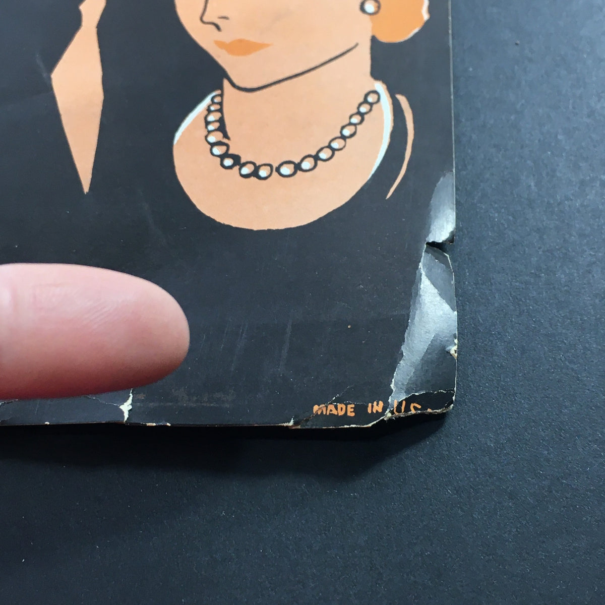Close-up of the vintage sheet music cover for "I'm Thru Saying I'm Thru" showing the damage on the edge where the finger points, reflecting its authentic vintage condition.