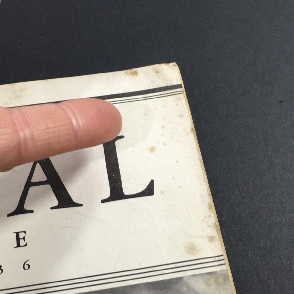 Detailed view of the top section of VTG The Mutual Magazine April 1936, with focus on the title and some wear indicating age.