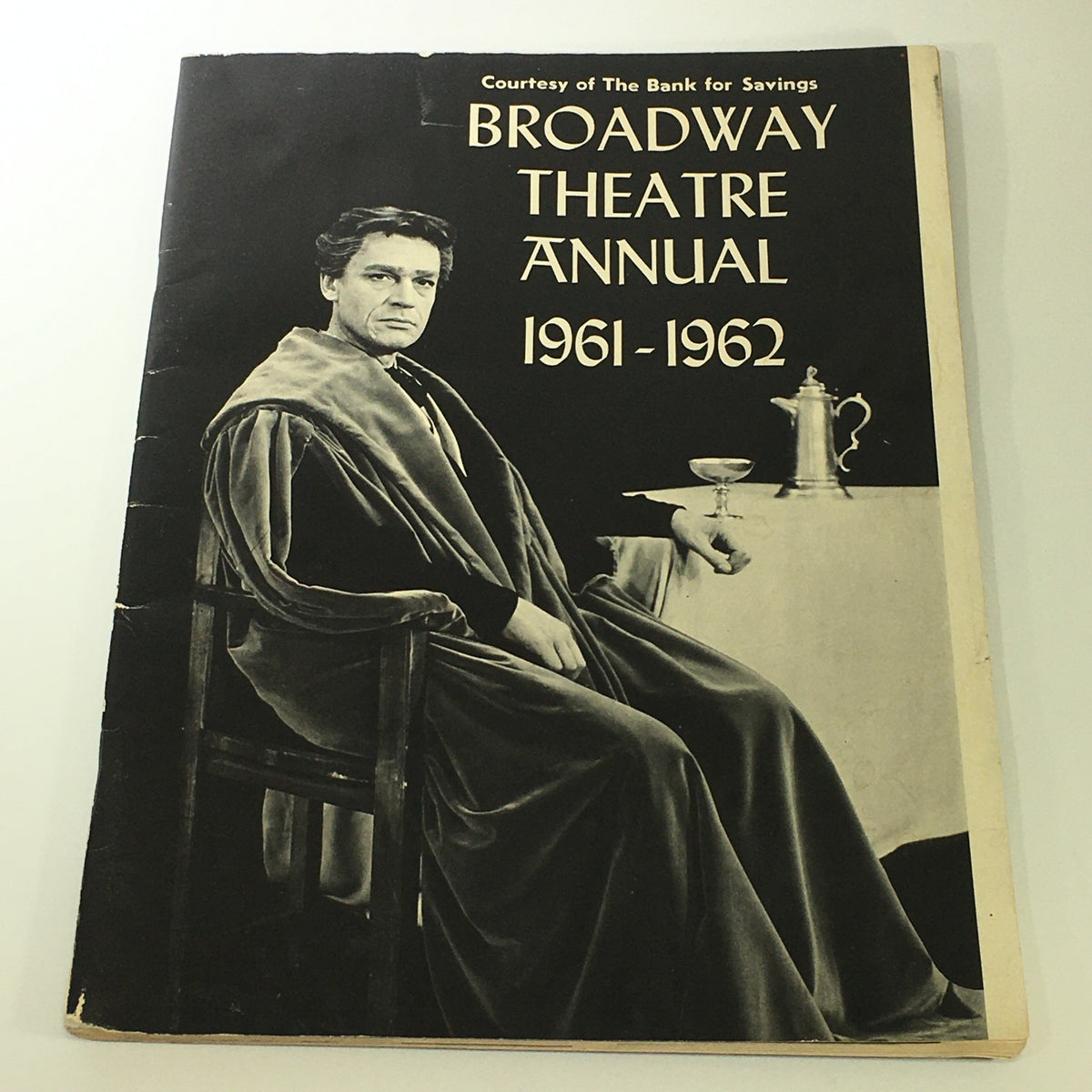 Cover of the VTG Broadway Theatre Annual 1961-1962 featuring a man in a robe, representing the enchanting world of Broadway with themes from My Fair Lady and The Sound of Music.