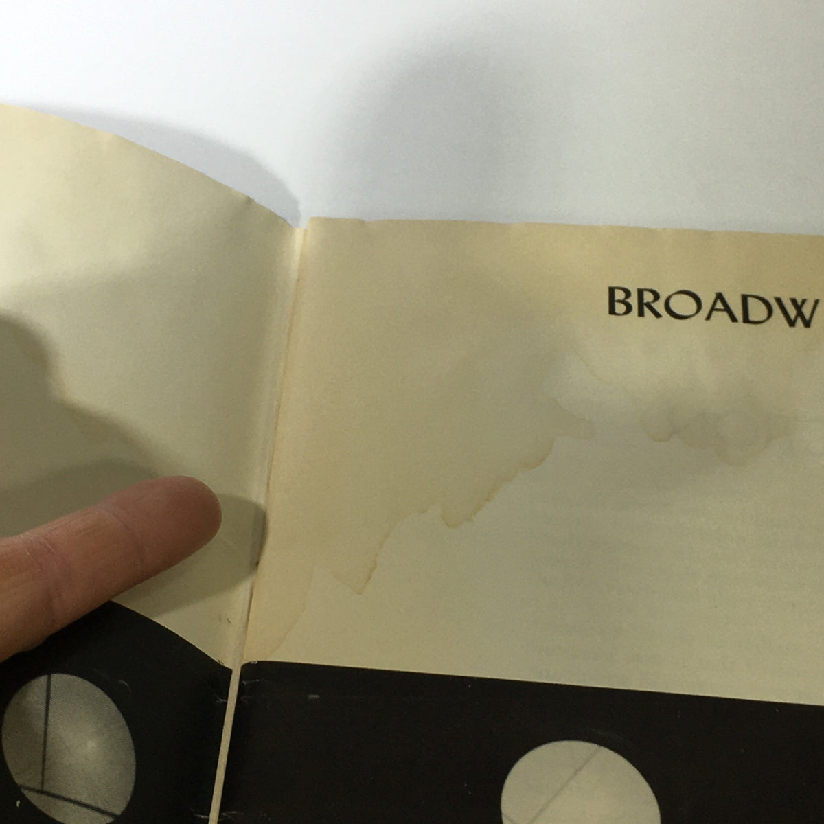 Detail of the VTG Broadway Theatre Annual 1961-1962 - My Fair Lady / The Sound of Music showing wear on the edge of the page.