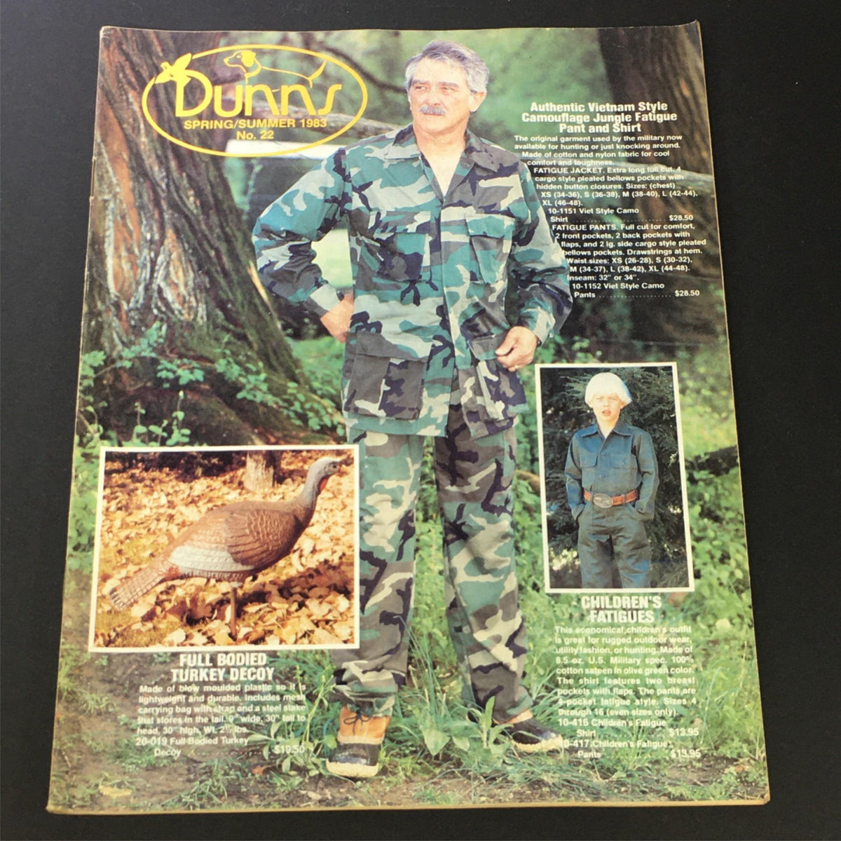 Cover of VTG Dunns Catalog Spring Summer 1983 No. 2 featuring a model in Vietnam Style Camouflage Fatigue clothing, showcasing military-inspired fashion trends from the early 1980s. The background includes a wooded setting and small images of a turkey decoy and children's fatigues.