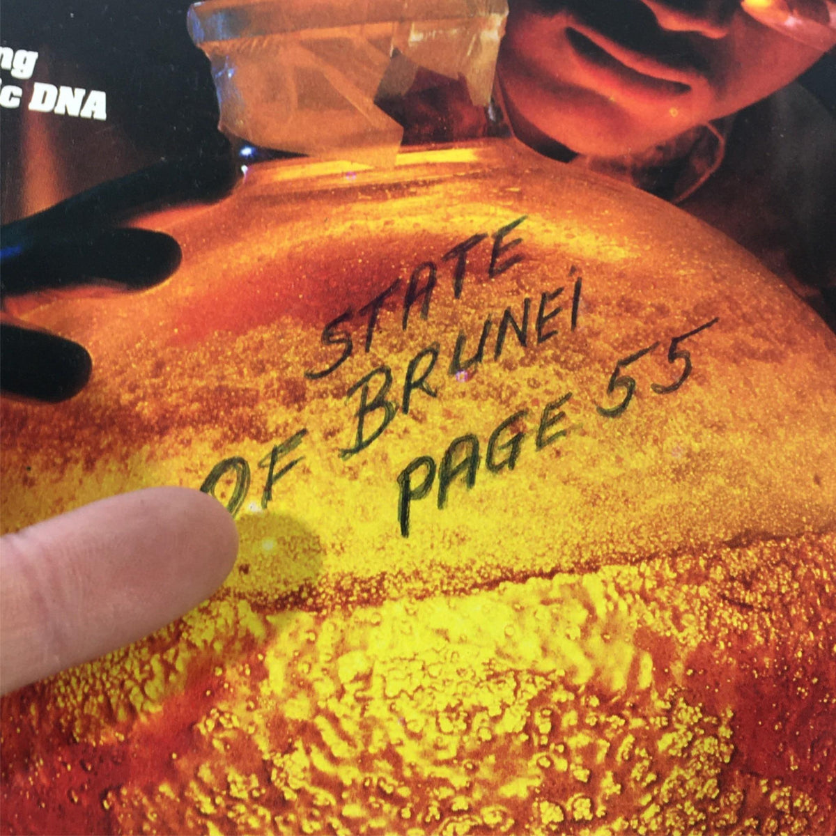 Close-up of the VTG Newsweek Magazine March 5 1984 cover showing a flask with 'STATE OF BRUNEI PAGE 55' written on it, showcasing the thematic focus on genetic science.