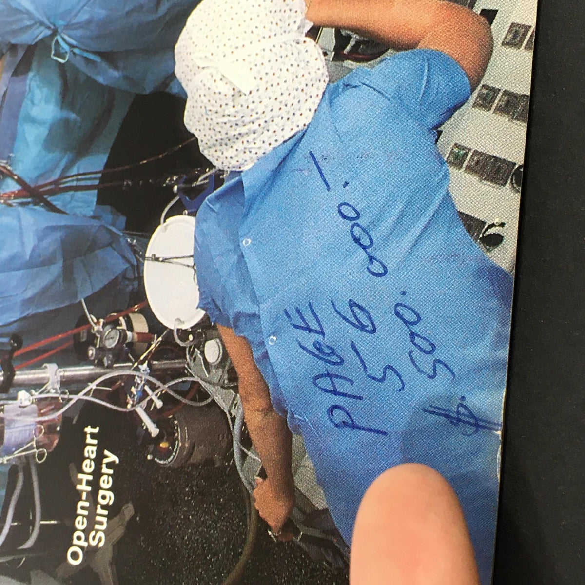 Detail of a surgical scene in the VTG US News & World Report Magazine from August 22, 1983, showing medical personnel in blue scrubs during an open-heart surgery, with annotations visible.