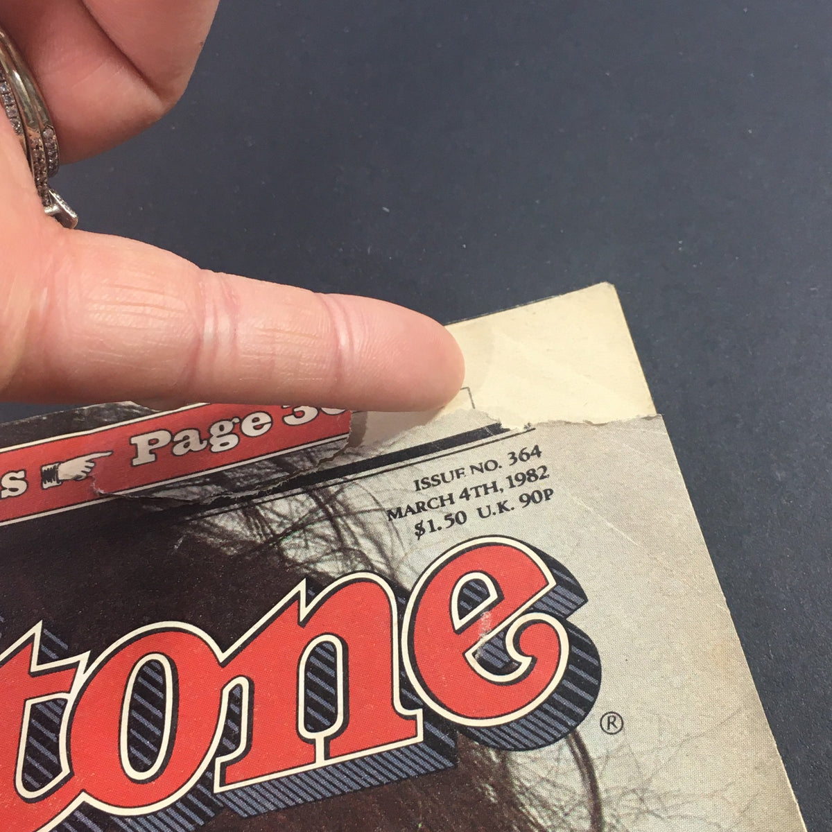 Close-up of the top edge of the VTG Rolling Stone Magazine March 4 1982, highlighting the issue number and publication date.