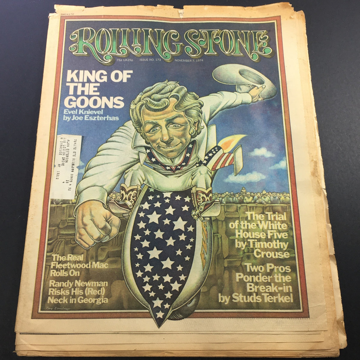 VTG Rolling Stone Magazine featuring Evel Knievel on the cover, dated November 7, 1974. The cover art showcases a stylized illustration of Evel Knievel with a cape and star-patterned outfit, highlighting engaging articles about Fleetwood Mac and 1970s cultural events.