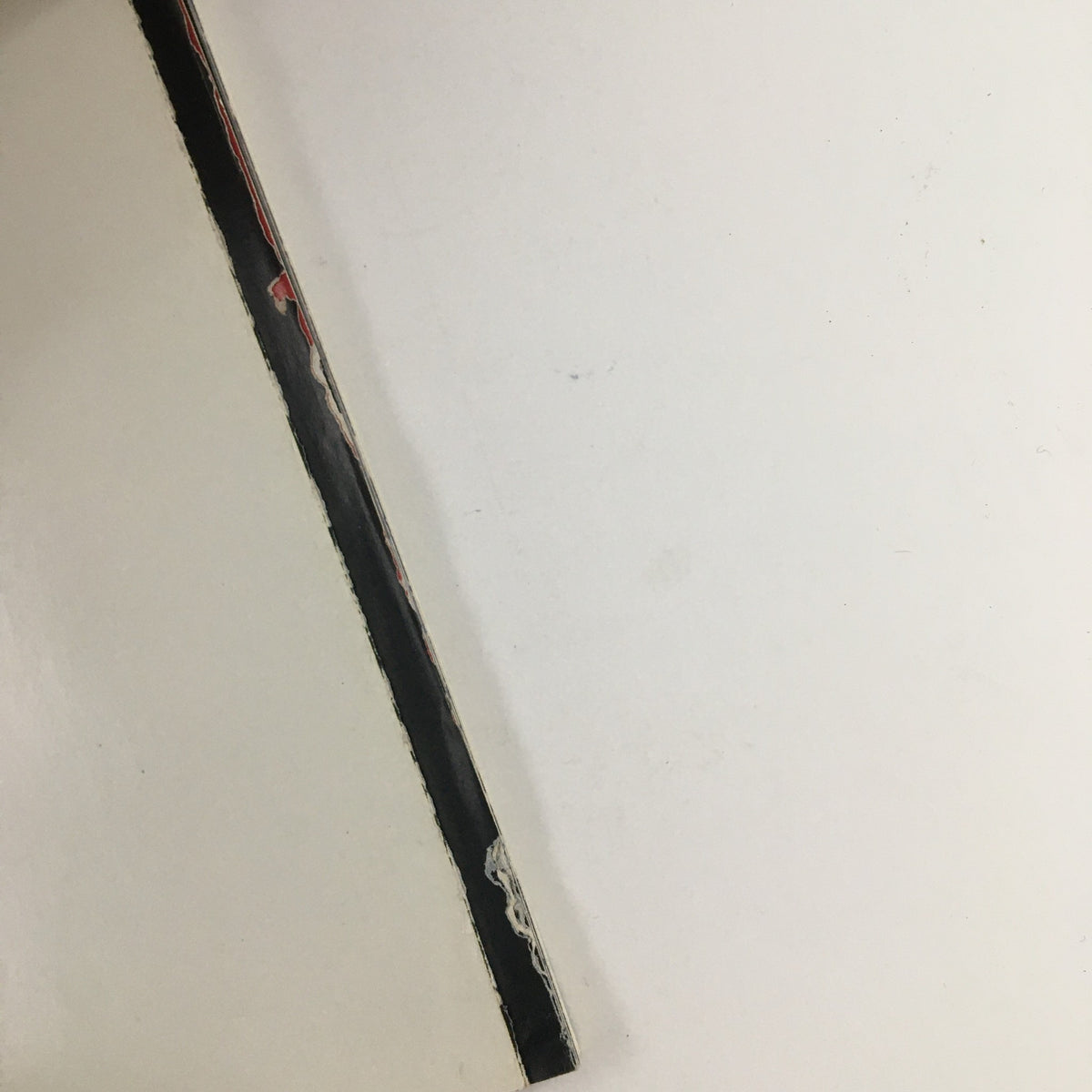 Side view of Esquire Magazine, March 1997, highlighting the worn edge and binding.