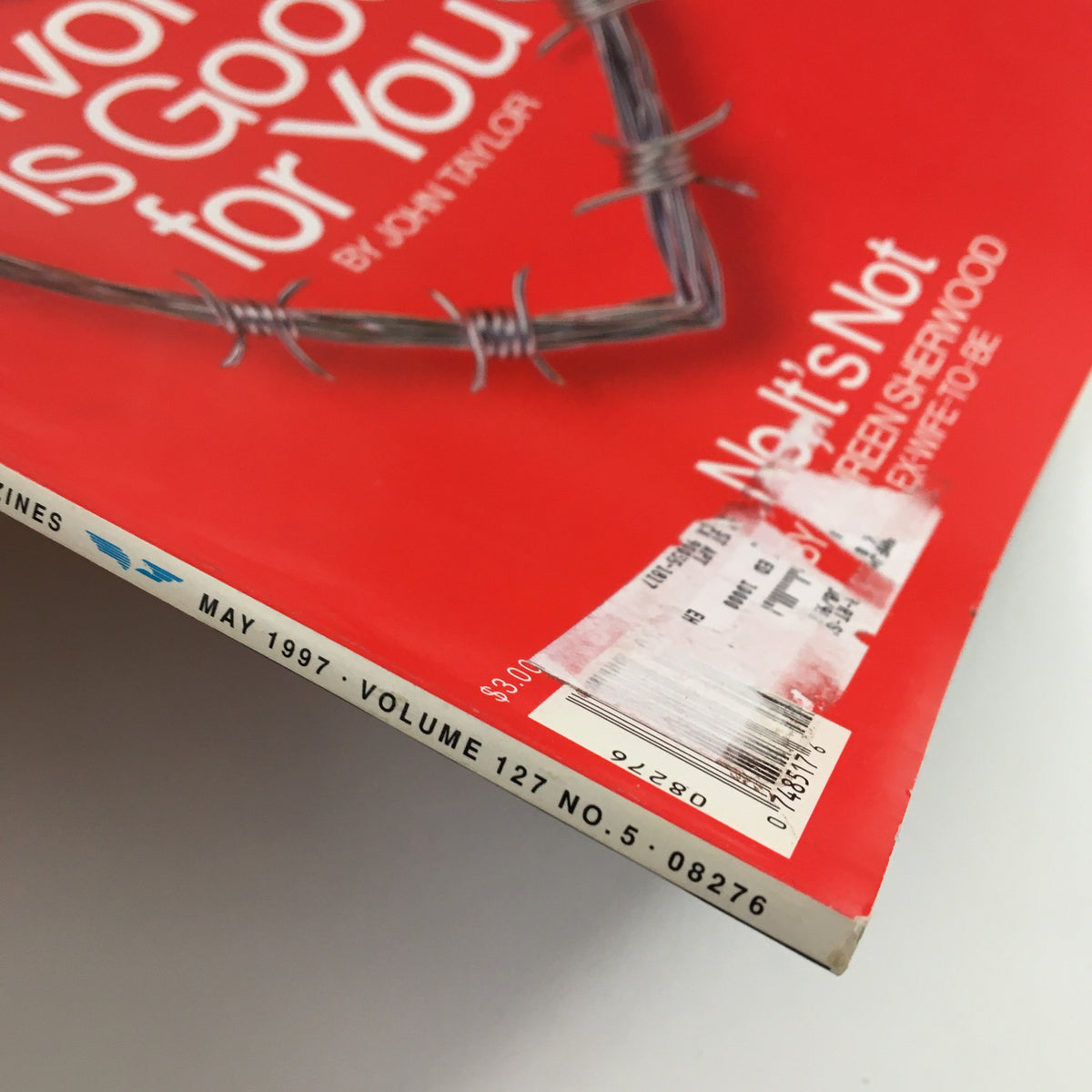 Side view of Esquire Magazine May 1997 showcasing the magazine's spine and an address label on the front cover, emphasizing its collectible nature.