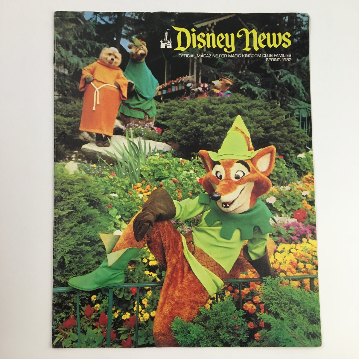 Cover of Disney News Magazine Spring 1982 featuring Robin Hood surrounded by flowers and wildlife, showcasing a nostalgic moment in Disney history.