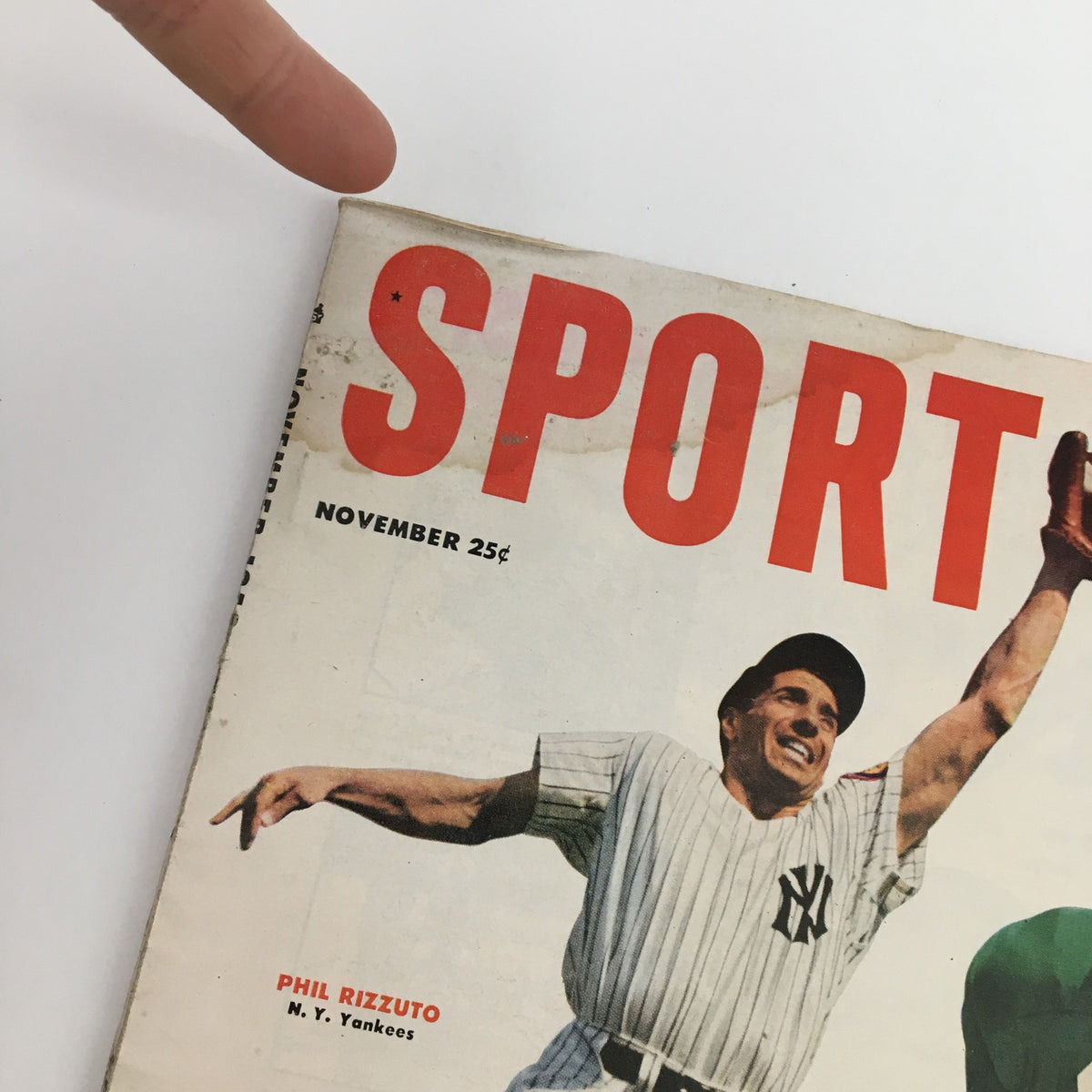 Close-up of the cover of Sport Magazine November 1953, showcasing the title and Phil Rizzuto's name, emphasizing its value as a collectible item for sports enthusiasts.