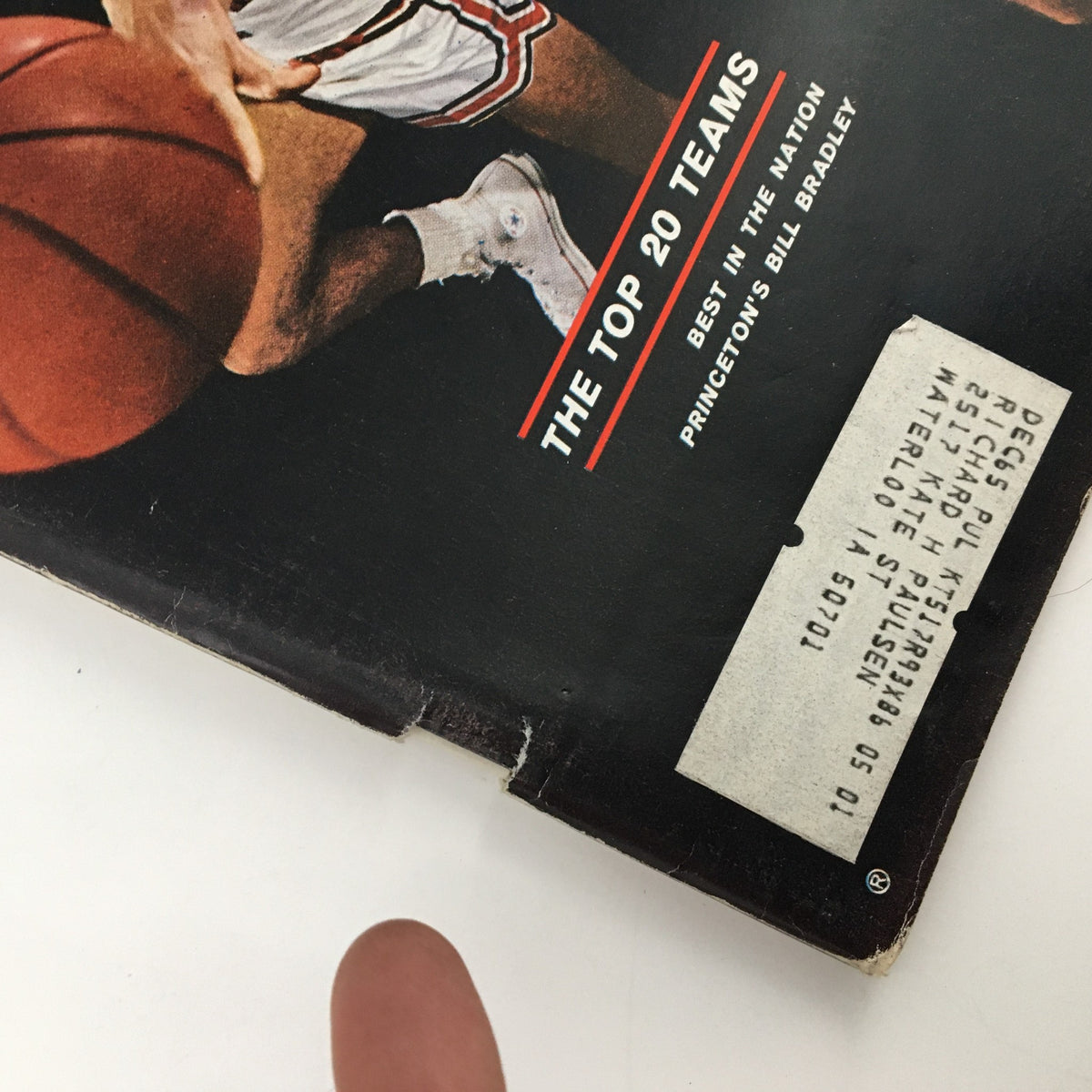 Side view of the cover of Sports Illustrated Magazine December 7, 1964, showing details including Bill Bradley's name and a vintage mailing label.