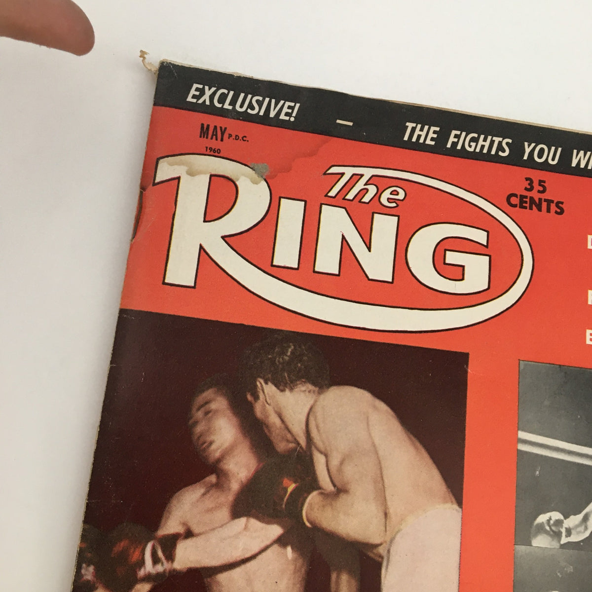 Close-up of the cover of The Ring Boxing Magazine from May 1960, emphasizing details of the title and images of boxers Pascual Pérez and Joe Becerra in action.