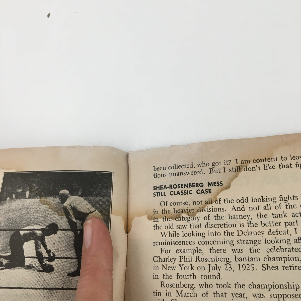 Page of The Ring Boxing Magazine May 1960 showing an article with water-damaged edges, discussing fighters and their techniques during a classic boxing match.