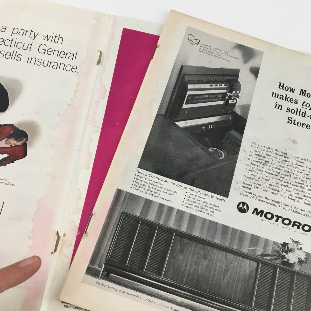 Interior view of Sports Illustrated Magazine dated February 14, 1966, showcasing pages featuring ads and articles with noticeable aging and wear.