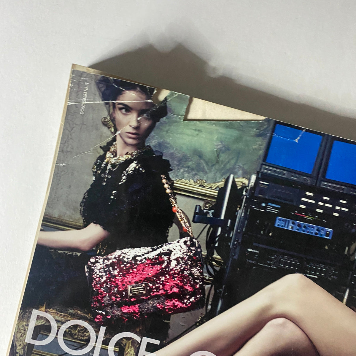 Close-up of Dolce & Gabbana advertisement from Numéro Magazine March 2009 displaying glamorous footwear and handbags.